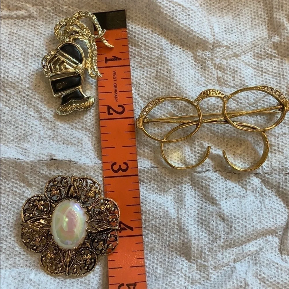 3 gold tone costume jewelry brooches